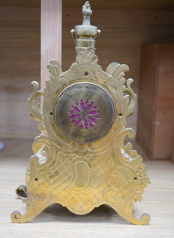 A late 19th century gilt bronze rococo style mantel clock, with pendulum, 38cm tall. Condition - fair, not tested